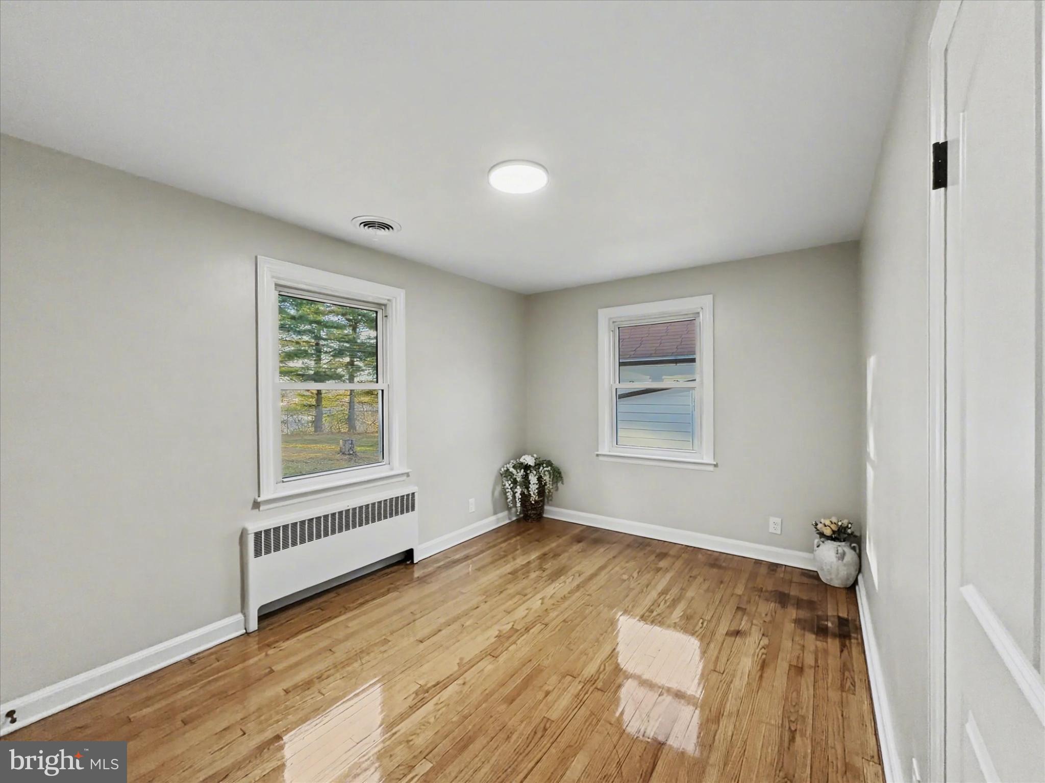 2196 South Queen Street York, PA 17402 - Photo 12 of 28 an empty room with wooden floor and windows