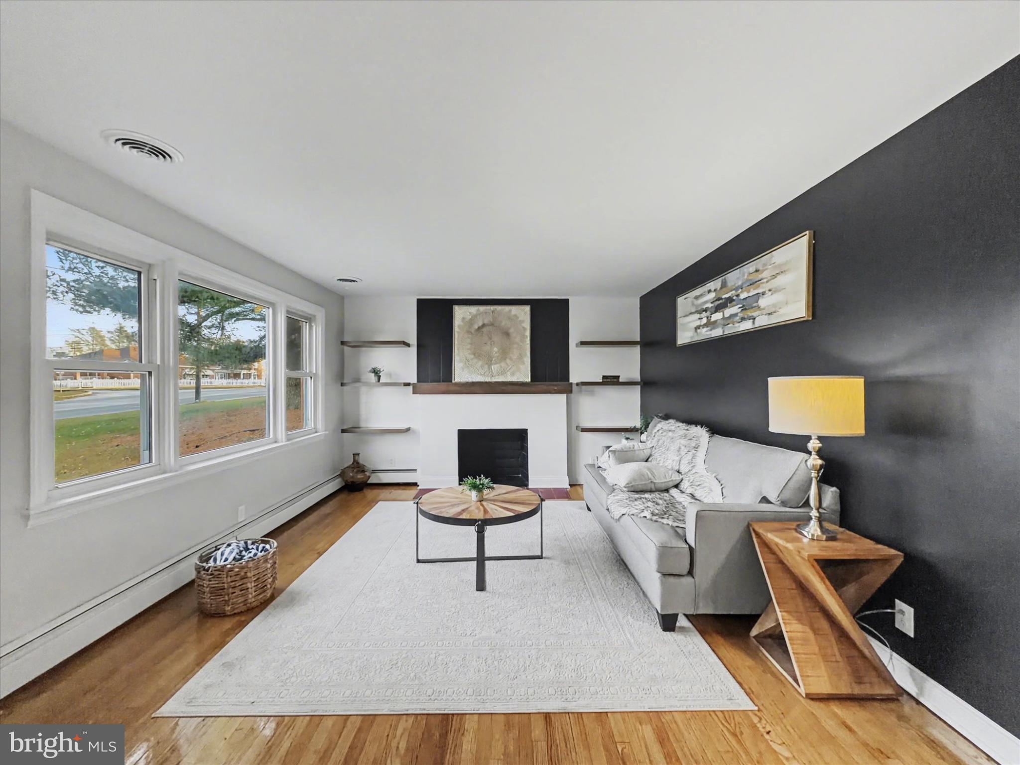 2196 South Queen Street York, PA 17402 - Photo 2 of 28 a living room with furniture and a fireplace