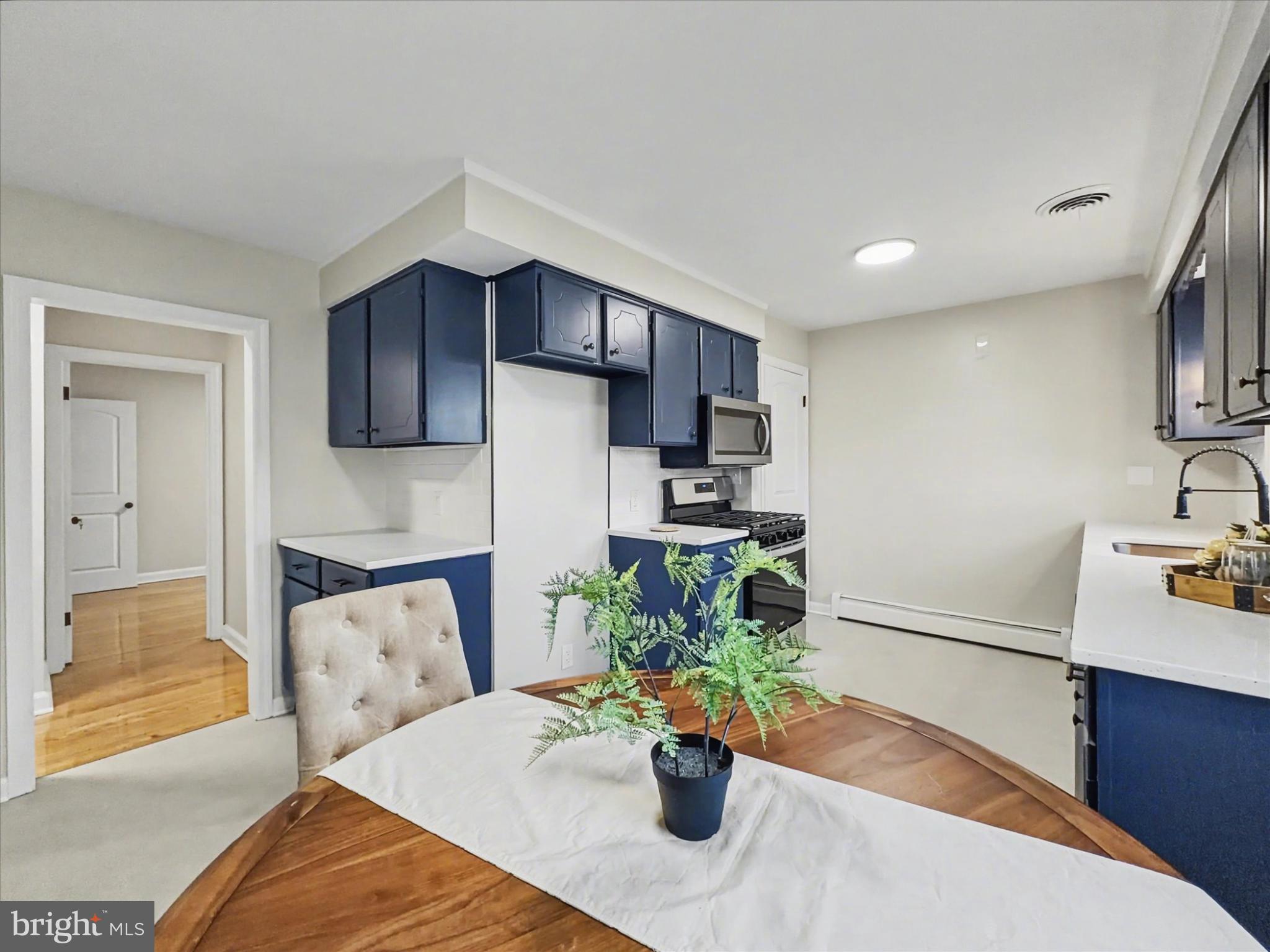 2196 South Queen Street York, PA 17402 - Photo 6 of 28 a bedroom with furniture and a potted plant