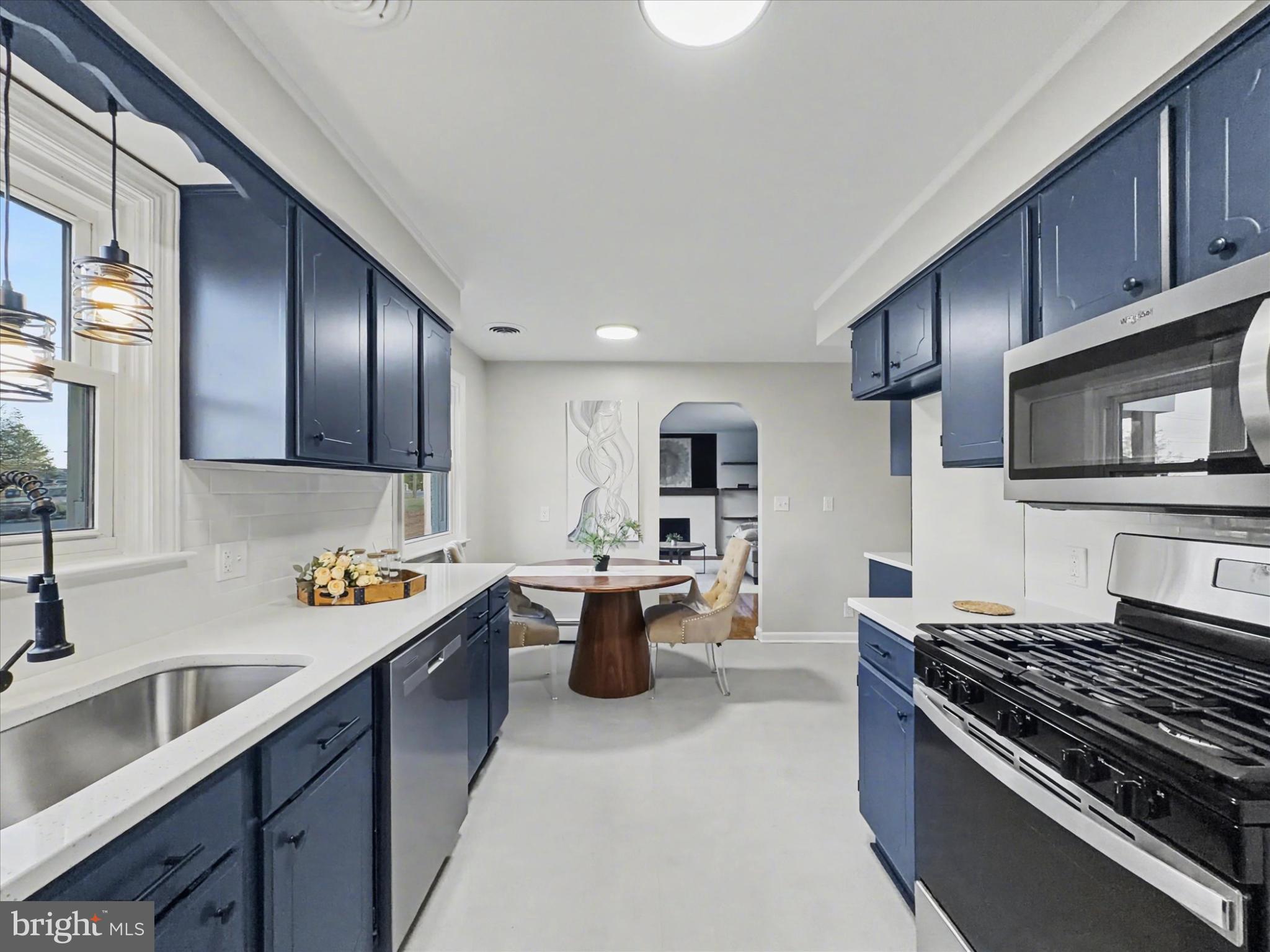 2196 South Queen Street York, PA 17402 - Photo 7 of 28 a kitchen with sink cabinets and stove top oven