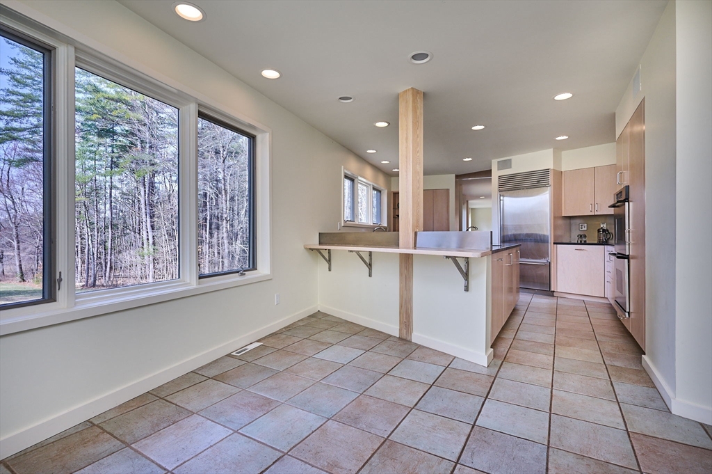 27 January Hills Road Amherst, MA 01002 - Photo 12 of 42 a kitchen with stainless steel appliances granite countertop a refrigerator and a stove top oven