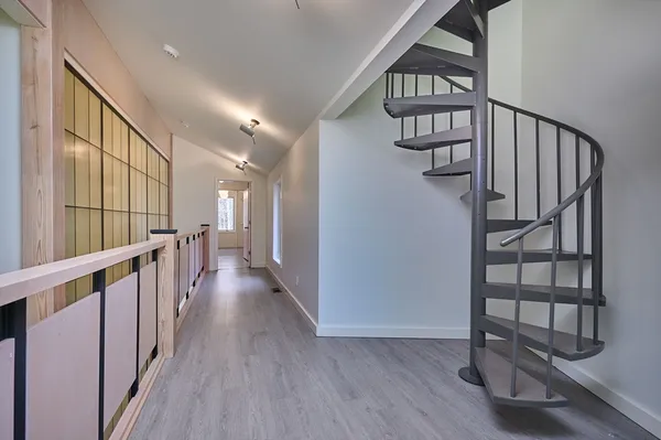 a view of entryway with stairs and wooden floor