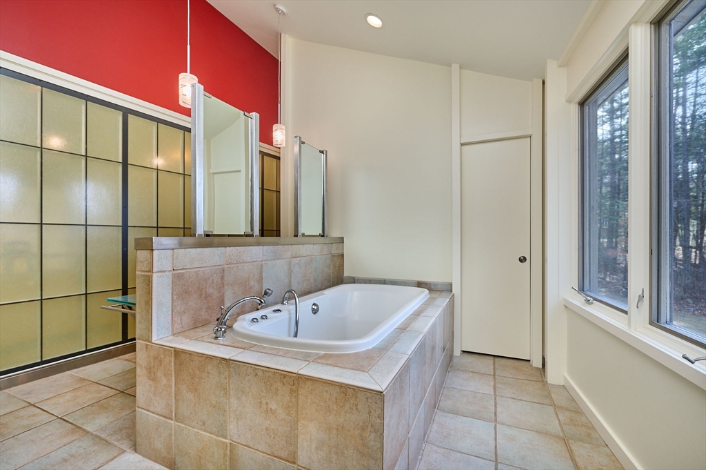 27 January Hills Road Amherst, MA 01002 - Photo 18 of 42 a bathroom with a bathtub and a sink