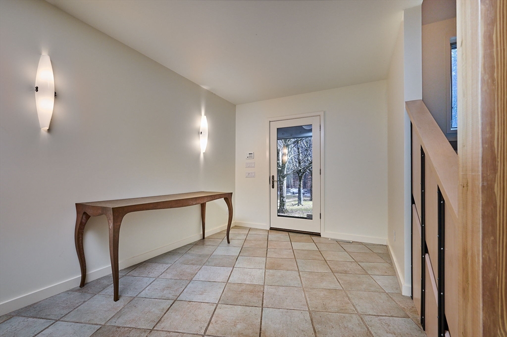 27 January Hills Road Amherst, MA 01002 - Photo 2 of 42 a view of room with furniture and a window