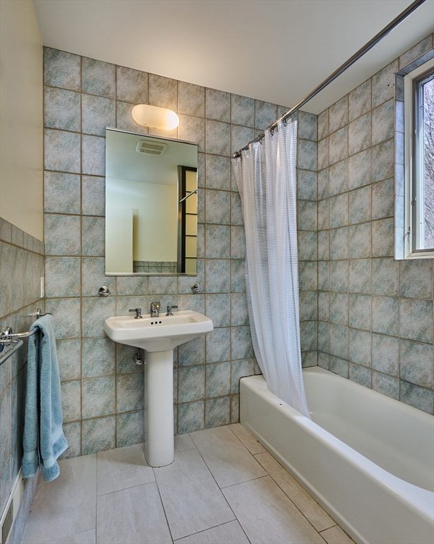 27 January Hills Road Amherst, MA 01002 - Photo 25 of 42 a bathroom with a sink a mirror and a bathtub