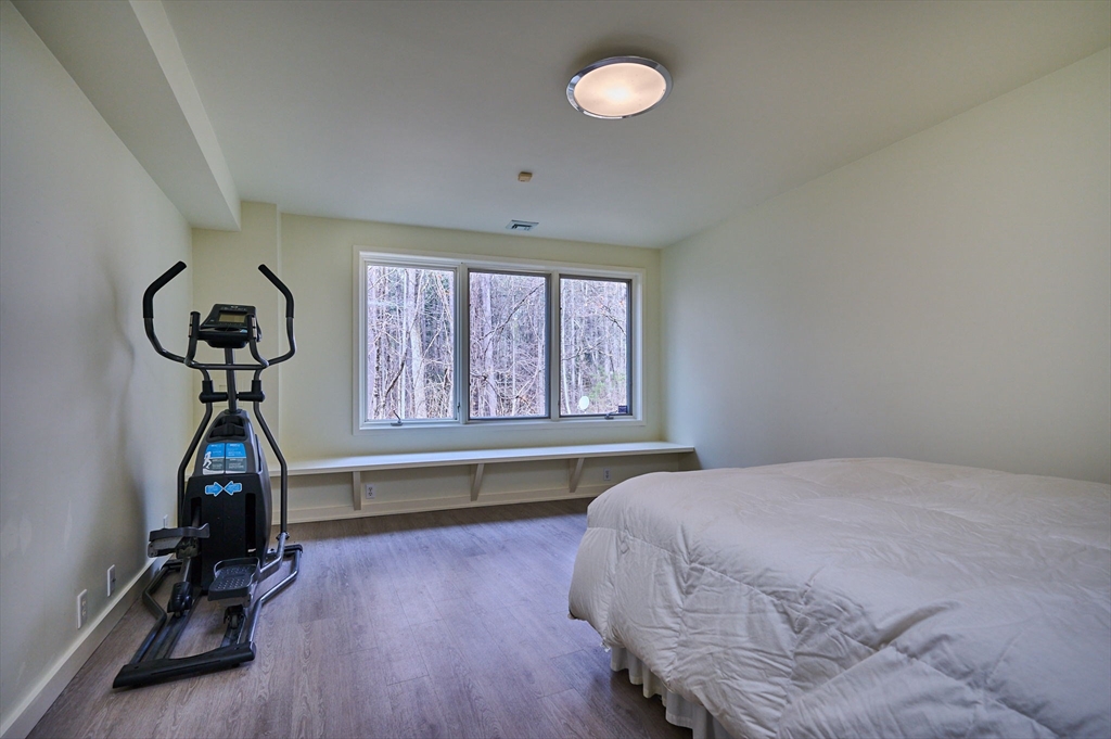 27 January Hills Road Amherst, MA 01002 - Photo 31 of 42 a bedroom with furniture and a large window