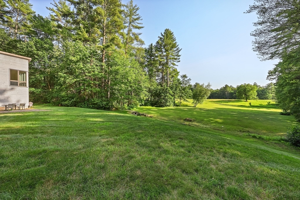 27 January Hills Road Amherst, MA 01002 - Photo 39 of 42 a view of a grassy field with trees