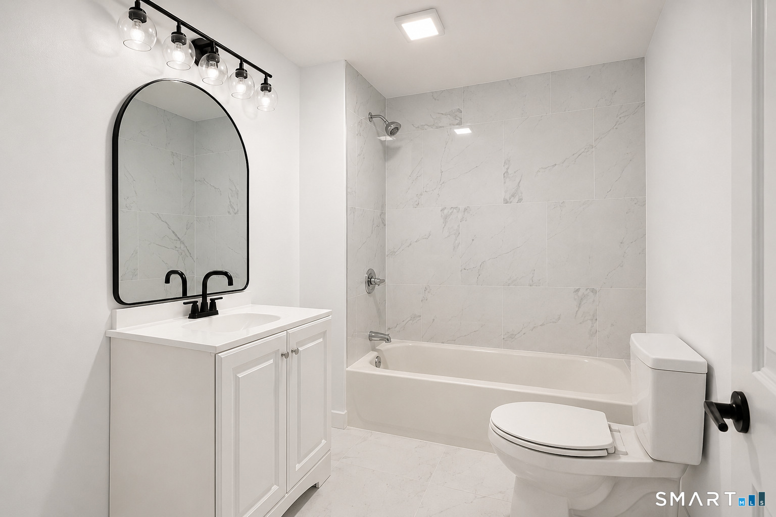 17 Rhoda Lane Bristol, CT 06010 - Photo 21 of 22 a bathroom with a sink a toilet and a mirror