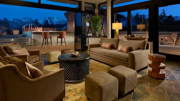 a living room with furniture a lamp and a fireplace