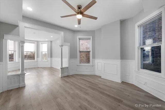 a view of a dining room with furniture and wooden floor