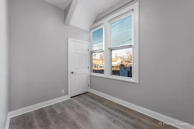 a kitchen with stainless steel appliances a stove a microwave and a refrigerator