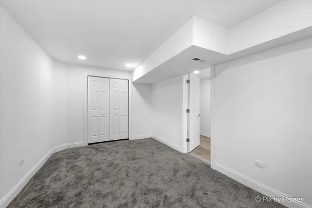 a view of a brick house with many windows