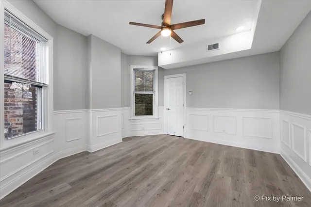 a living room with furniture potted plant and a window