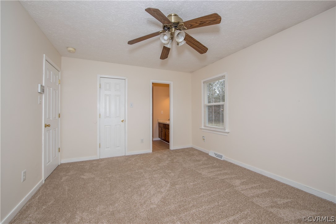 12910 Bailey Bridge Road Midlothian, VA 23112 - Photo 18 of 39 Primary Bedroom w/ Full Bathroom & His/Her Closets