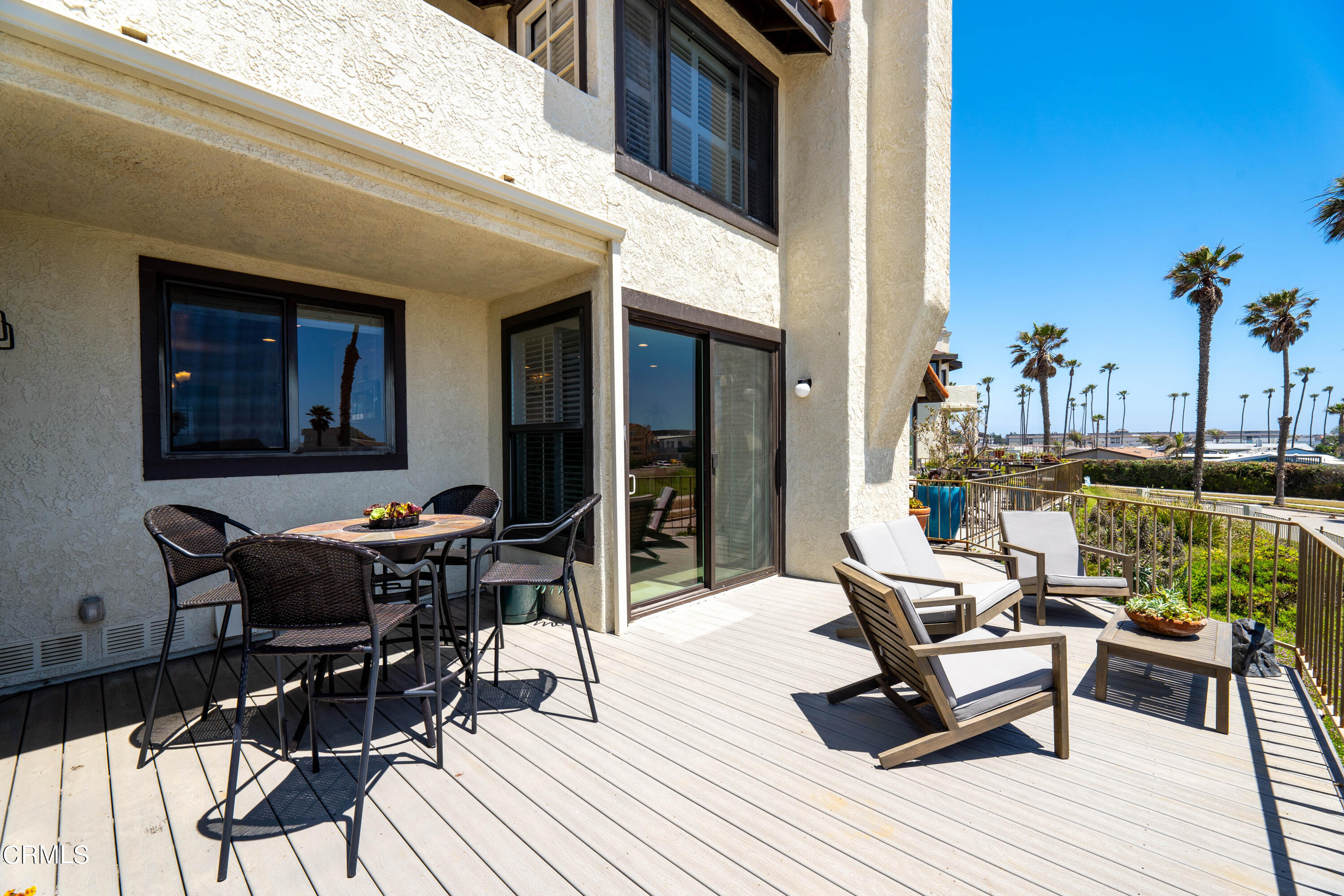 2315 Vina Del Mar Oxnard, CA 93035 - Photo 18 of 53 a view of a dinning tables and chairs in patio of the house
