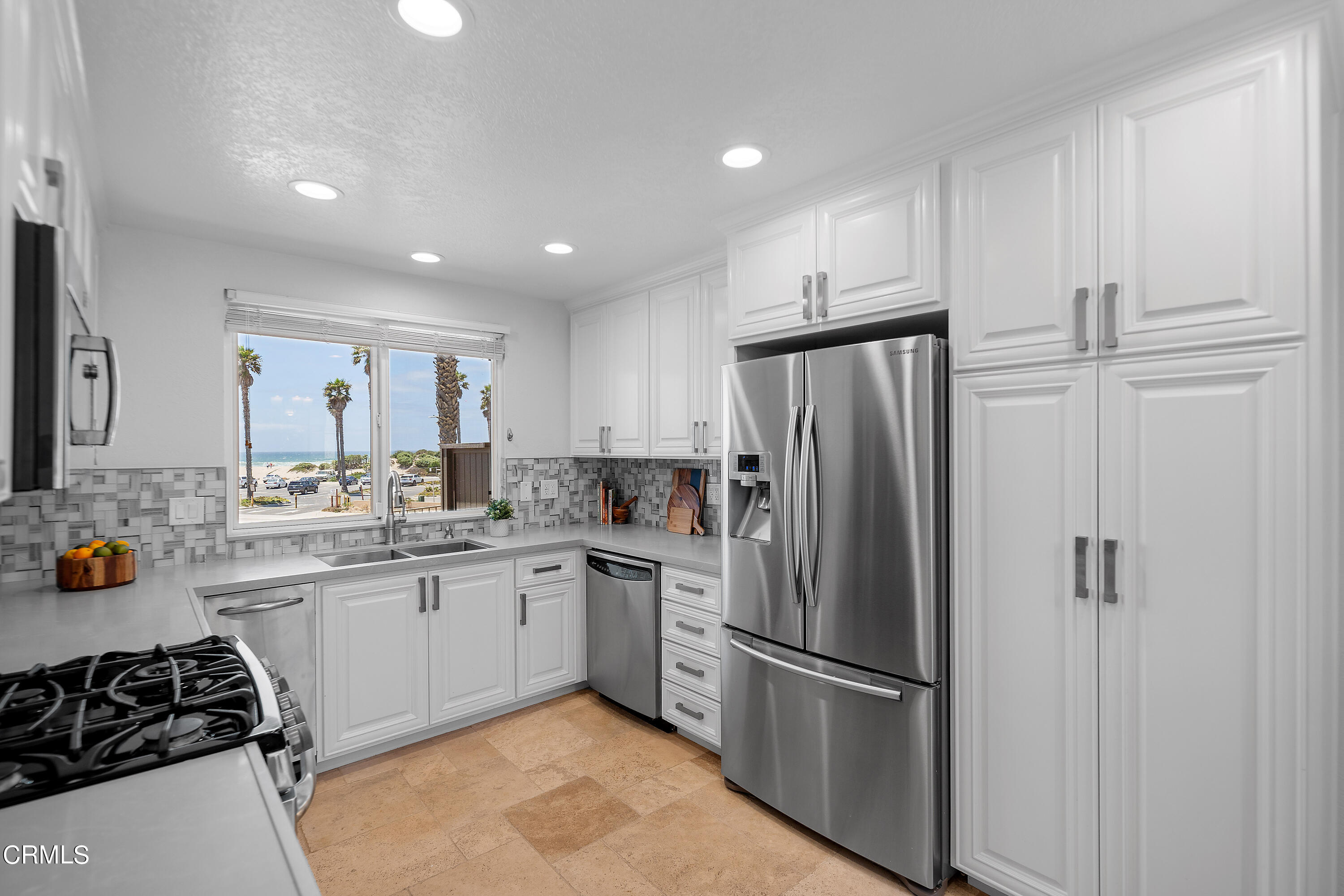 2315 Vina Del Mar Oxnard, CA 93035 - Photo 20 of 53 a kitchen with stainless steel appliances granite countertop a refrigerator and a sink