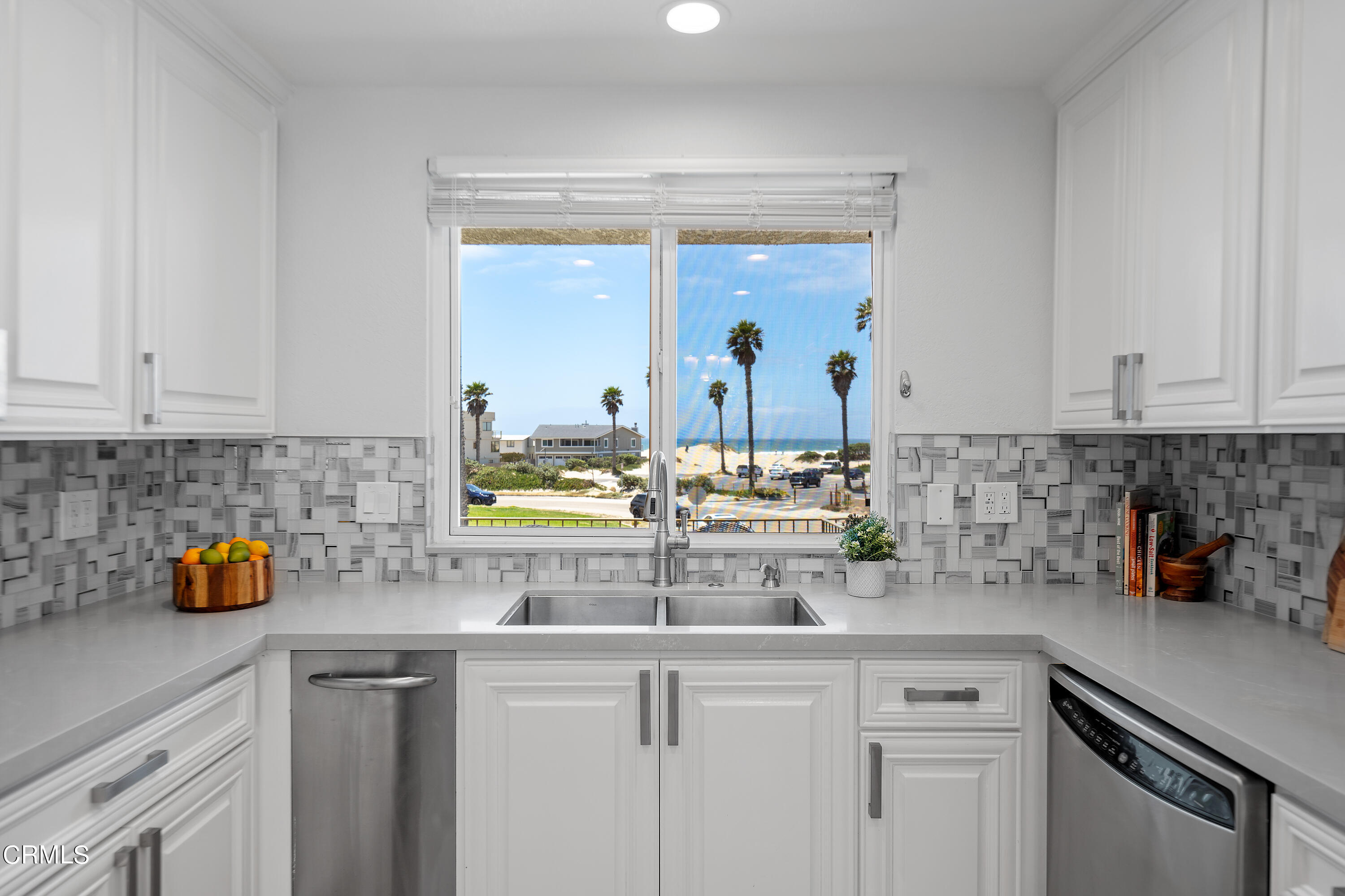2315 Vina Del Mar Oxnard, CA 93035 - Photo 23 of 53 a kitchen with stainless steel appliances granite countertop a sink a stove and cabinets
