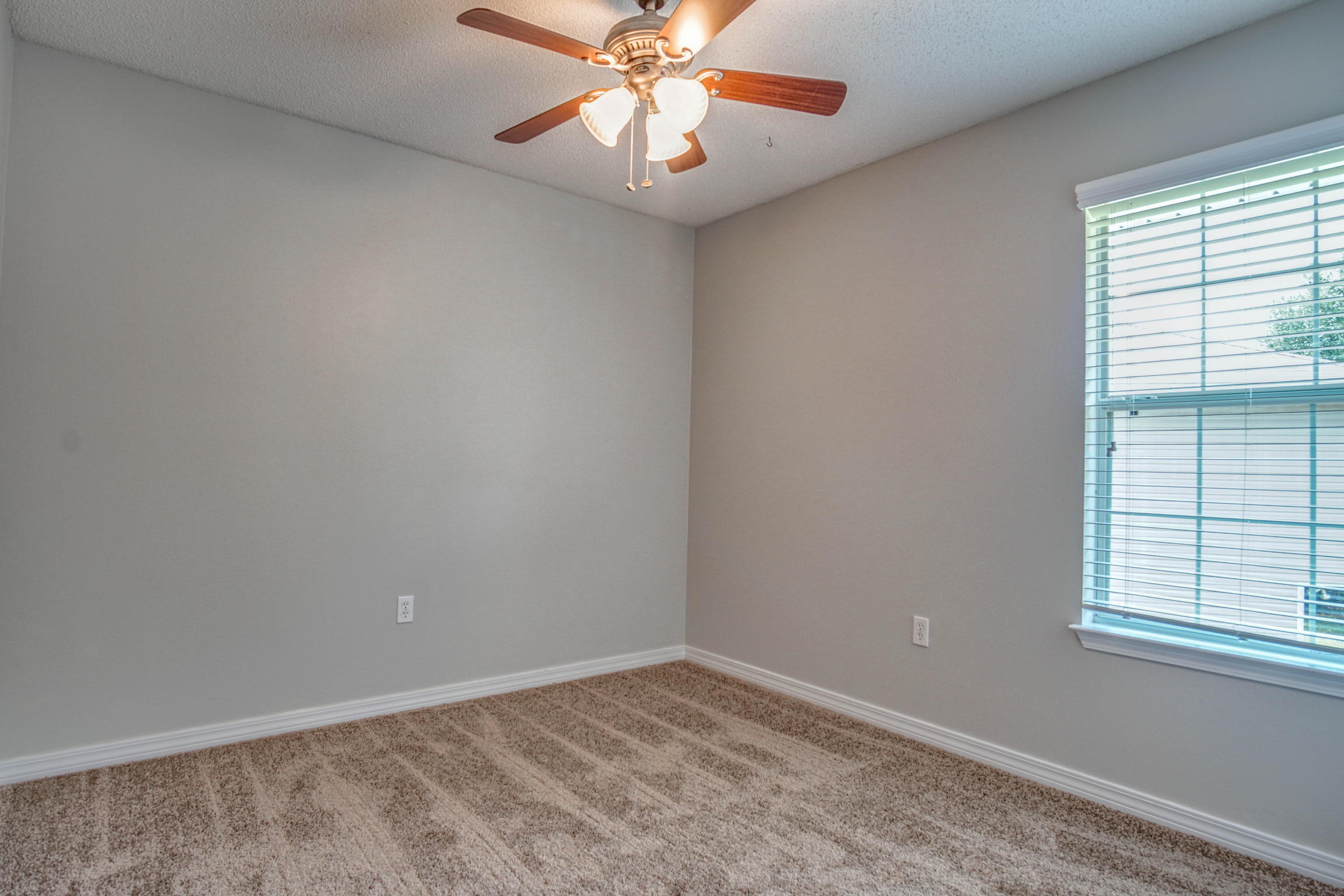 412 Plate Drive Crestview, FL 32539 - Photo 12 of 25 an empty room with windows and fan