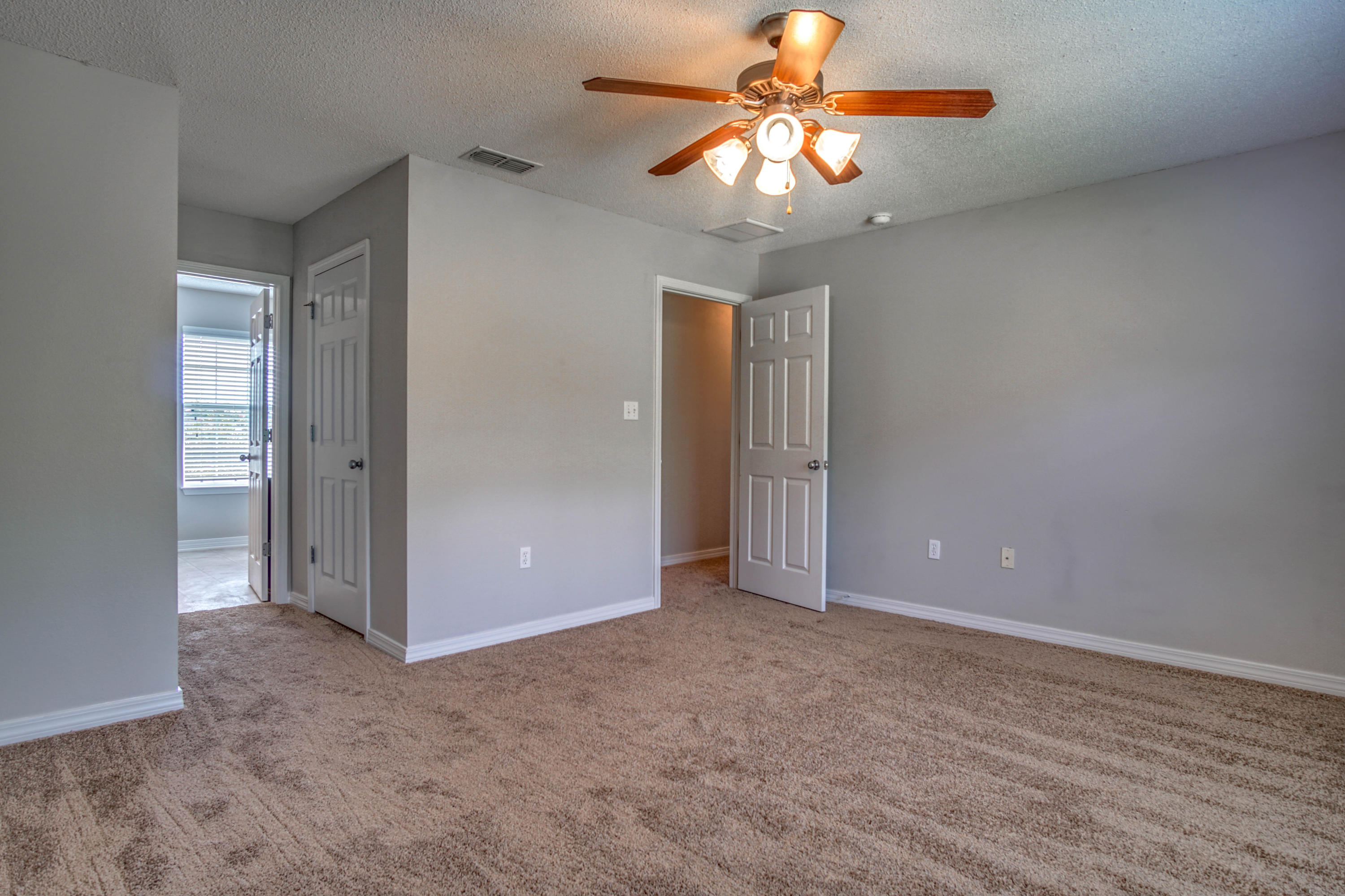 412 Plate Drive Crestview, FL 32539 - Photo 17 of 25 an empty room with closet and a ceiling fan