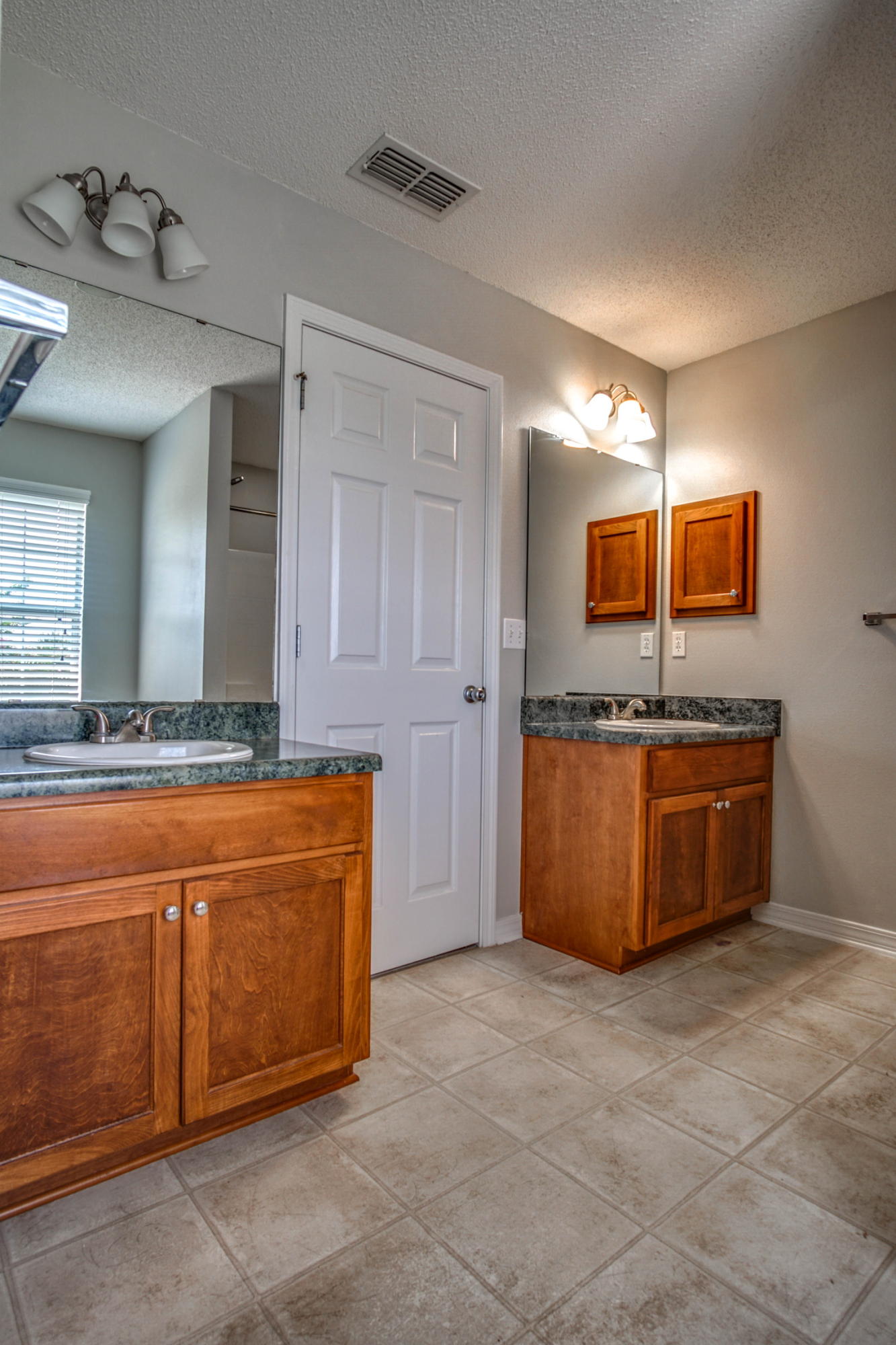 412 Plate Drive Crestview, FL 32539 - Photo 18 of 25 a large kitchen with stainless steel appliances granite countertop a stove and a sink
