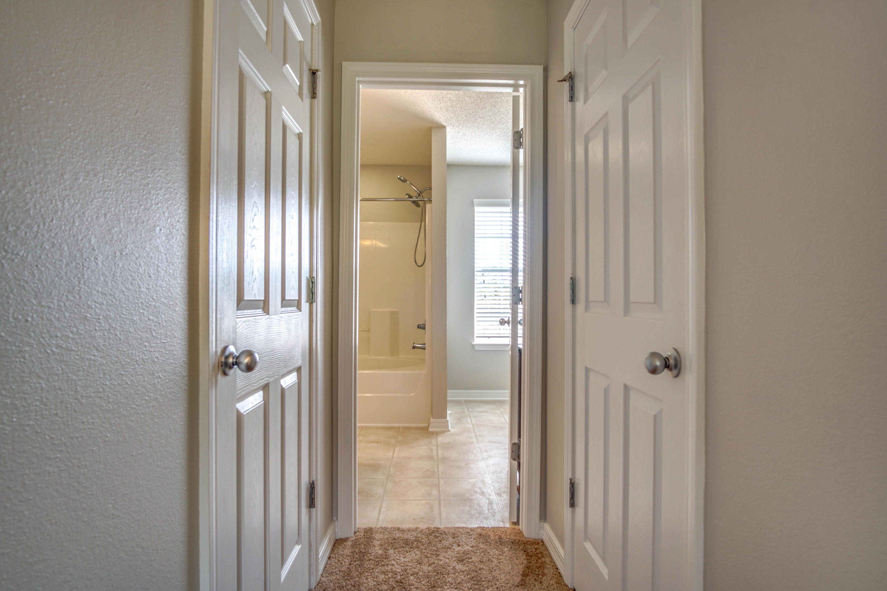 412 Plate Drive Crestview, FL 32539 - Photo 20 of 25 a view of a bathroom from a hallway