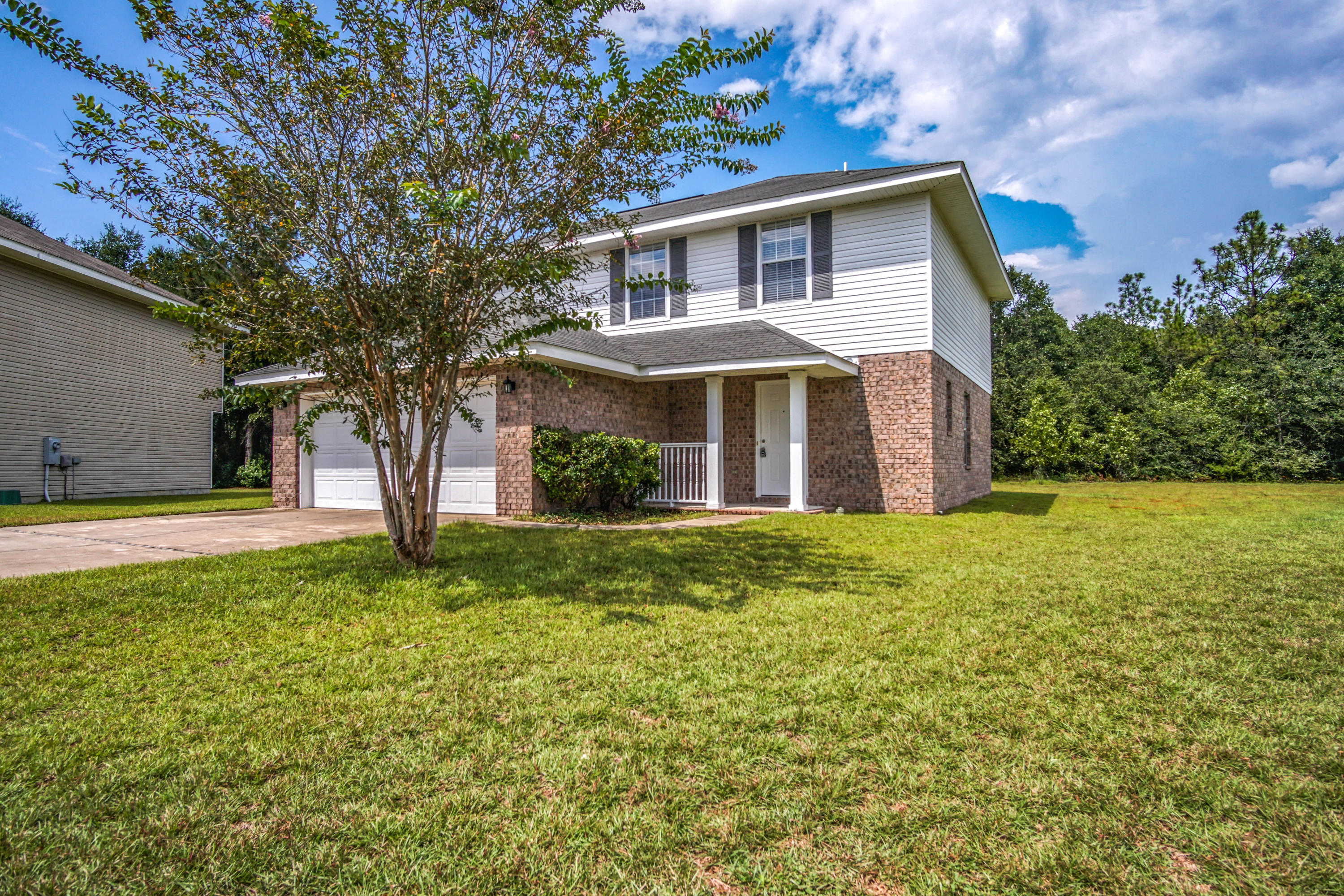 412 Plate Drive Crestview, FL 32539 - Photo 23 of 25 a front view of a house with a yard