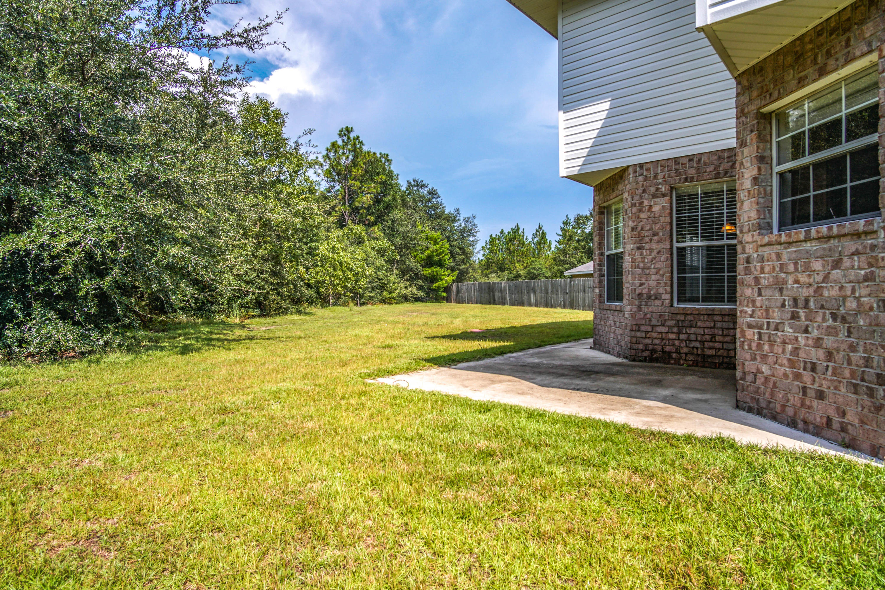 412 Plate Drive Crestview, FL 32539 - Photo 24 of 25 a view of a house with a yard
