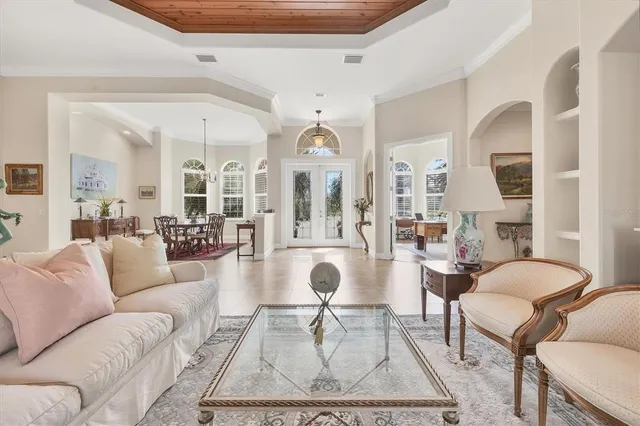 a living room with furniture a rug and white walls