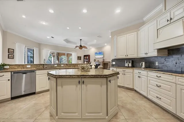 a kitchen with stainless steel appliances granite countertop a sink and cabinets