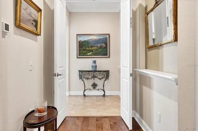 a view of a room with wooden floor and chair