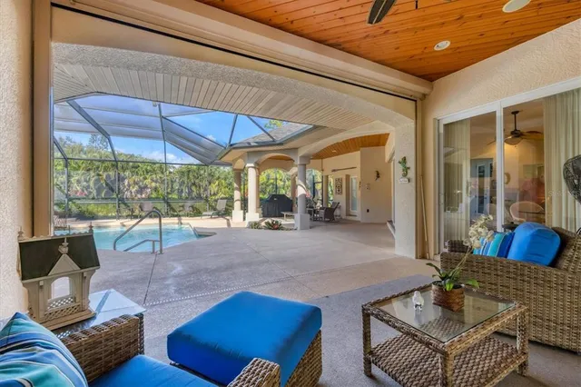 a living room with furniture a rug and white walls