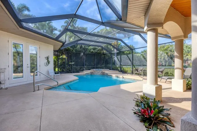 a view of a patio with table and chairs potted plants