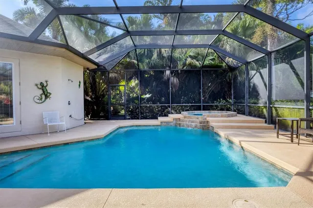 a view of swimming pool with a patio