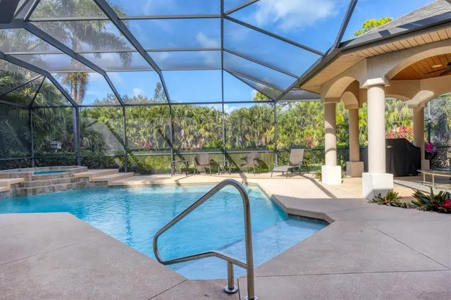 a view of a swimming pool with a patio