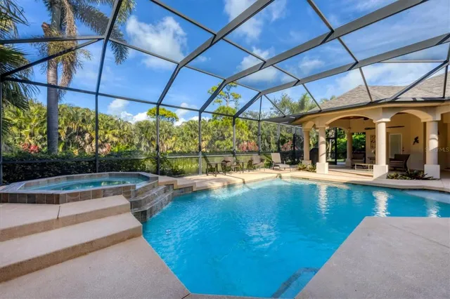 a view of a swimming pool with a patio