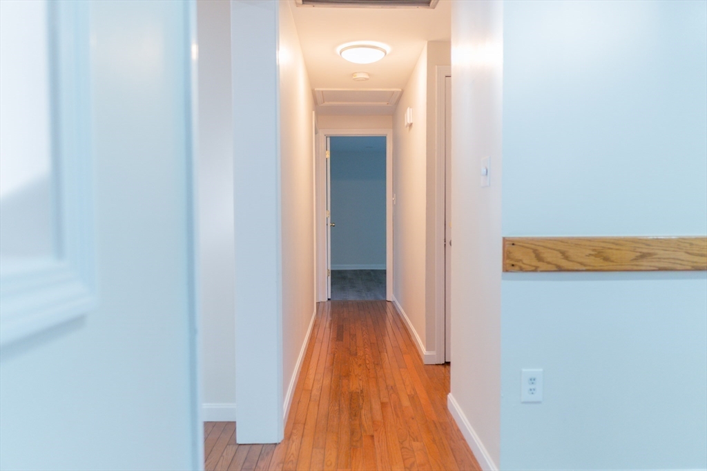 24 Little John Road Falmouth, MA 02536 - Photo 12 of 34 a view of a hallway with wooden floor