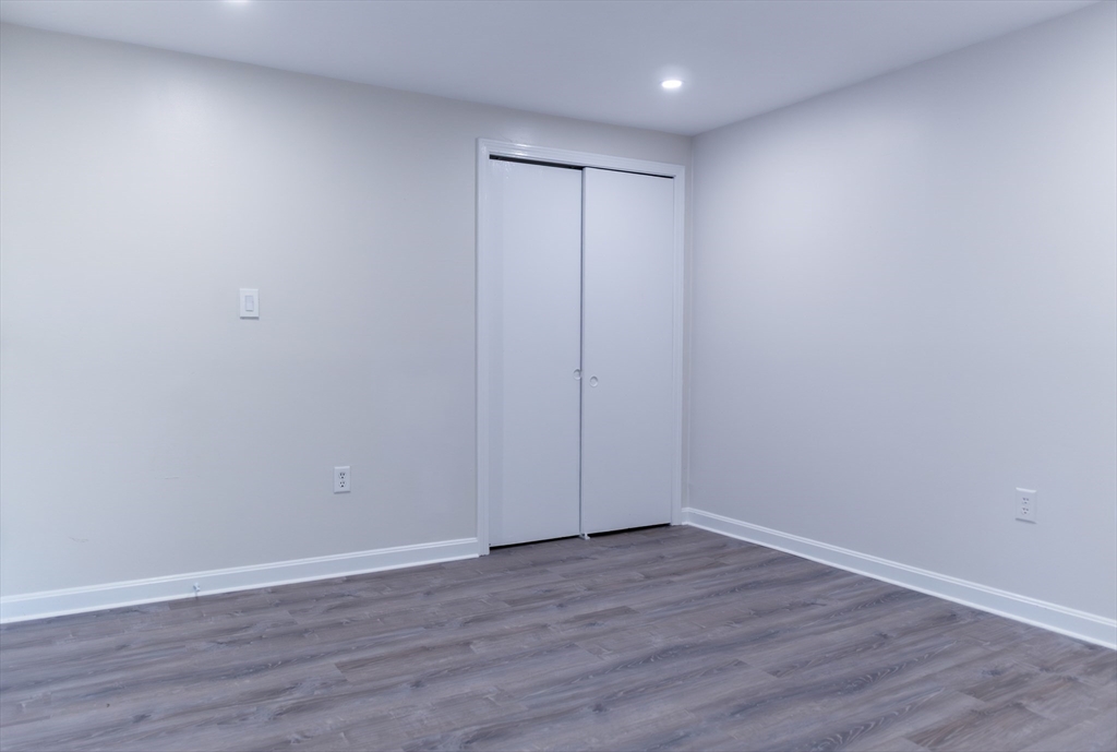24 Little John Road Falmouth, MA 02536 - Photo 15 of 34 a view of an empty room with wooden floor