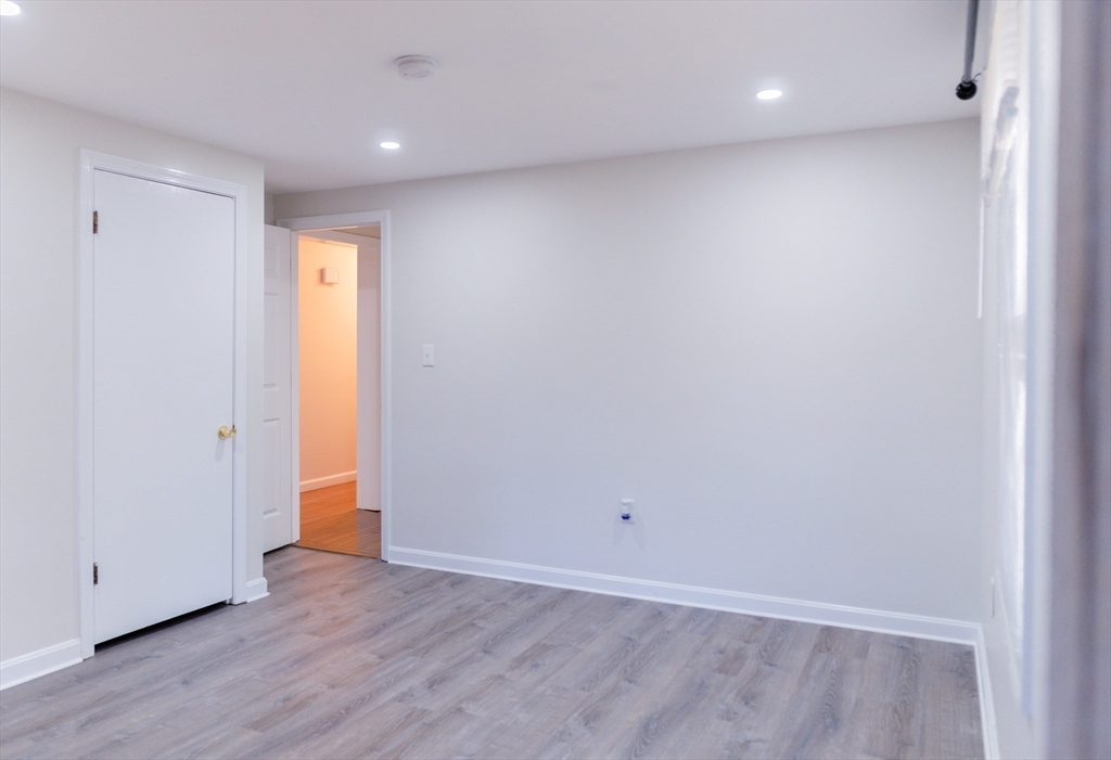 24 Little John Road Falmouth, MA 02536 - Photo 20 of 34 a view of an empty room with wooden floor