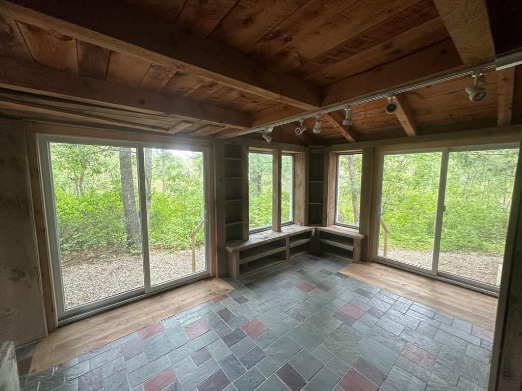 24 Little John Road Falmouth, MA 02536 - Photo 24 of 34 a view of a room with wooden walls and roof