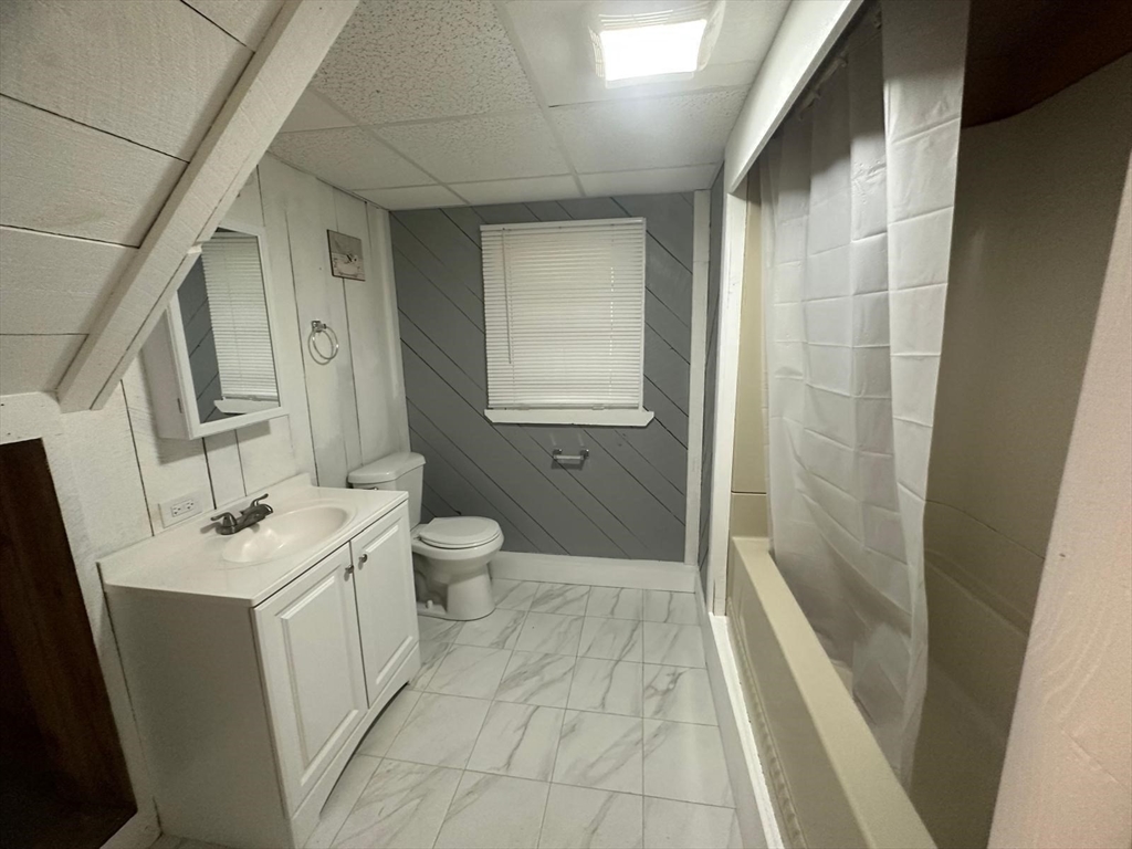 24 Little John Road Falmouth, MA 02536 - Photo 25 of 34 a bathroom with a sink a toilet a mirror and shower