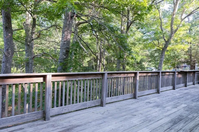 a view of a porch with chairs and backyard