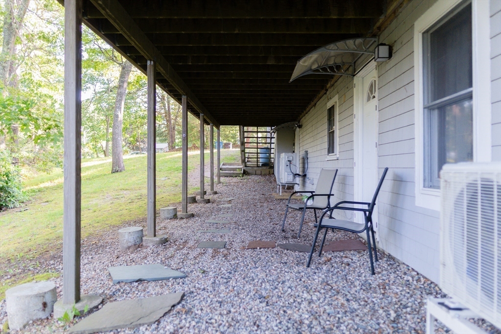 24 Little John Road Falmouth, MA 02536 - Photo 29 of 34 a view of a porch with chairs and backyard
