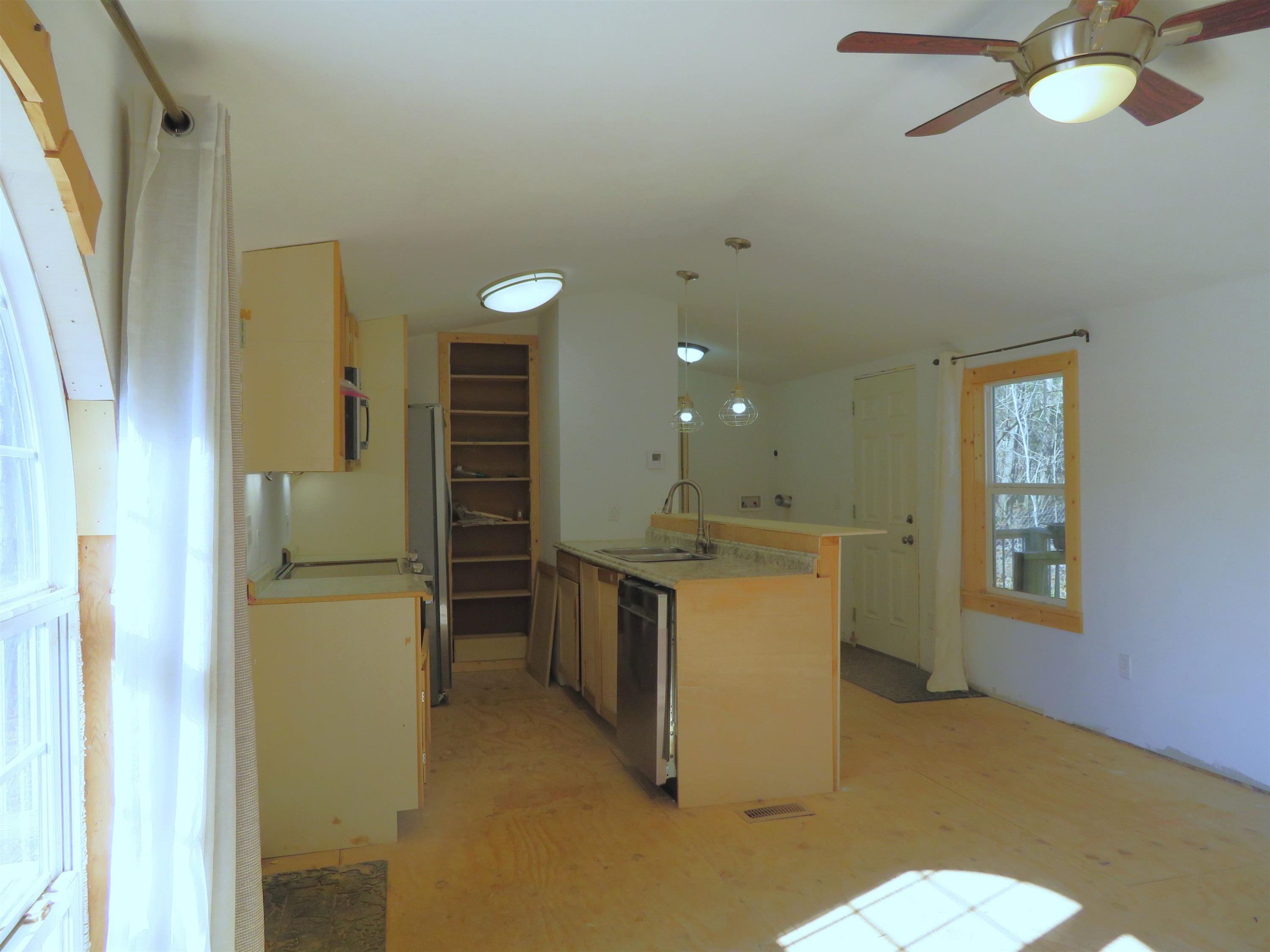 737 Potts Chapel Road Jackson, TN 38305 - Photo 27 of 31 a kitchen with a refrigerator and a sink