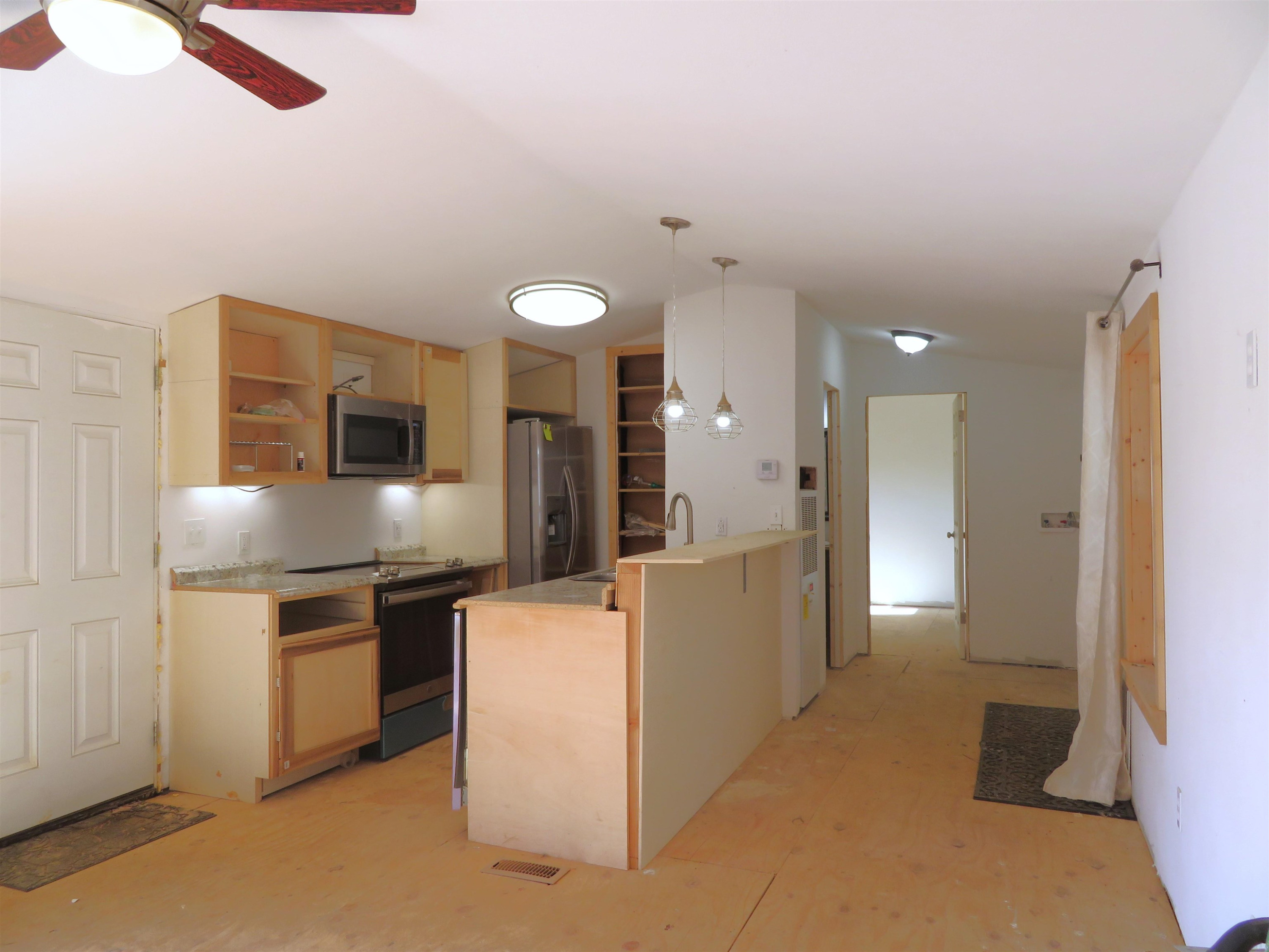 737 Potts Chapel Road Jackson, TN 38305 - Photo 28 of 31 a kitchen with cabinets and stainless steel appliances