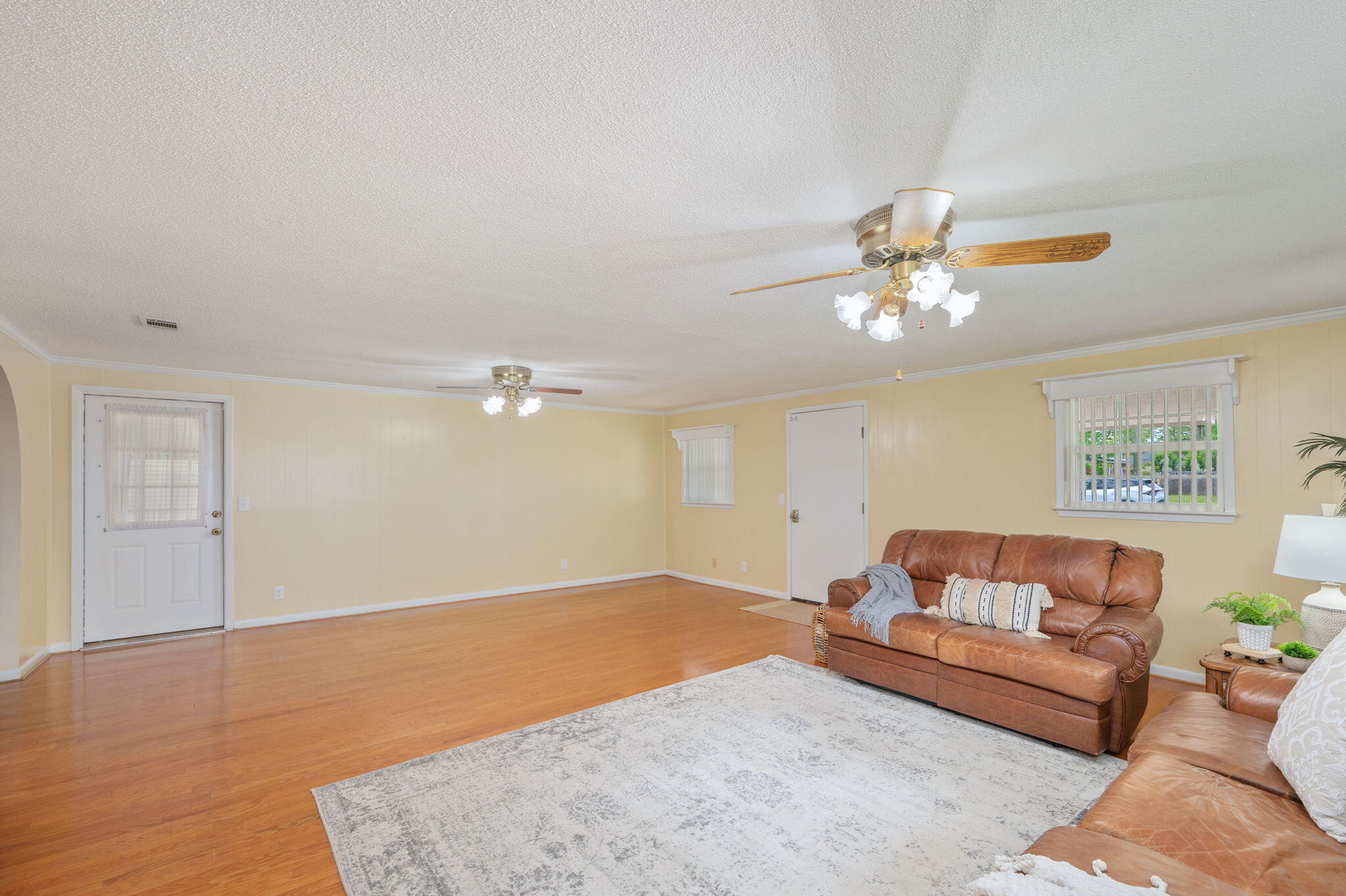 501 Jones Road Crestview, FL 32536 - Photo 8 of 32 a living room with furniture and a chandelier