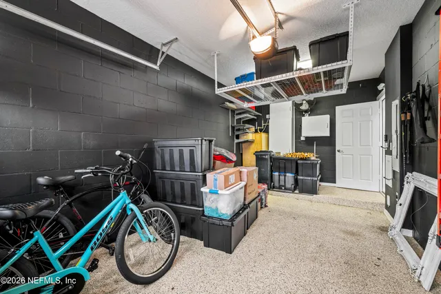 a utility room with dryer and bicycles