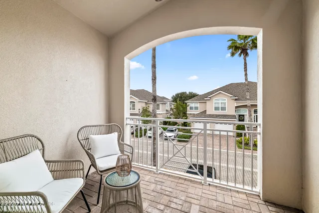 a view of living room with furniture and wooden floor