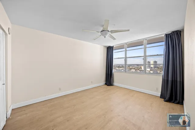 a picture of a glass door with a view of living room