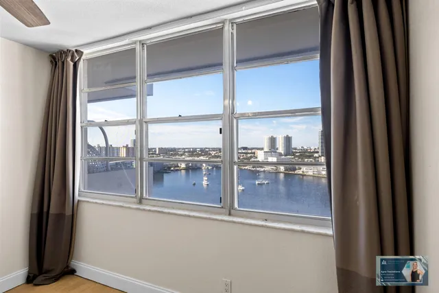 a view of a room with cabinet and a ceiling fan