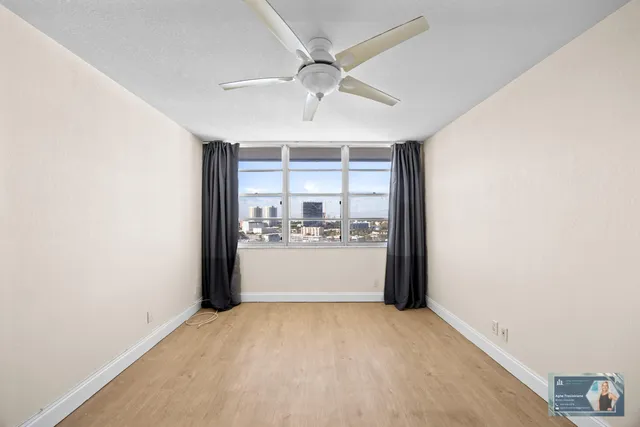 a view of an empty room with a window